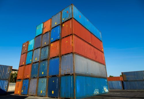 Cargo container yard. cargo shipping container box in logistic shipping yard. colorful cargo container stacks in shipping port