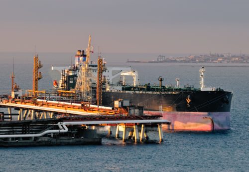 Supertanker loading at oil terminal