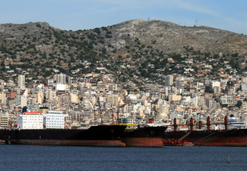 Cargo container ships and tankers docked at the port of Perama near Athens