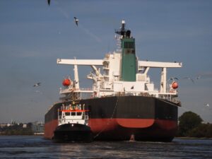 Capesize vessel leaving port in ballast