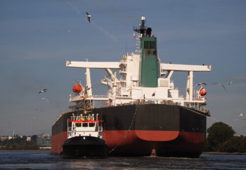 Capesize vessel leaving port in ballast