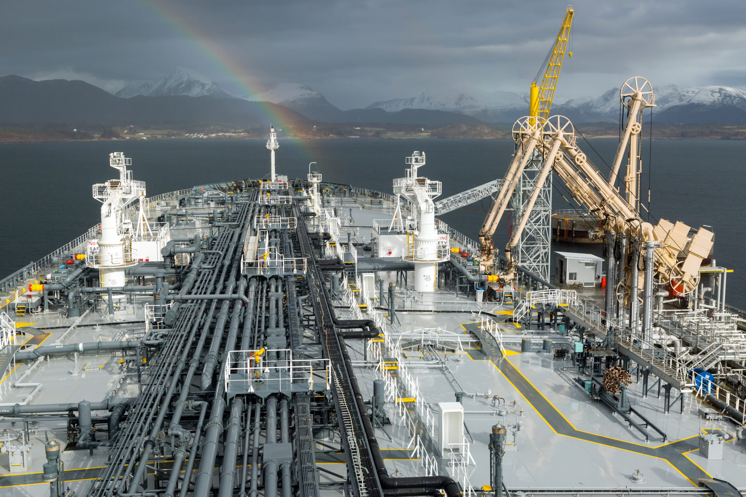 Deck view of an Oil product tanker loading from shore terminal