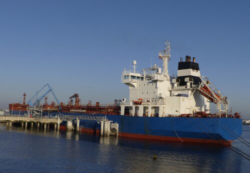 Blue Tanker ship discharging Petroleum products at the Oil Terminal