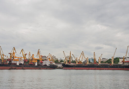 Lifting cargo cranes, ships and grain dryer in Sea Port of Odessa, Black Sea, Ukraine.