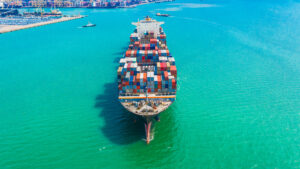 Container ship arriving in port, logistic business import export shipping and transportation.