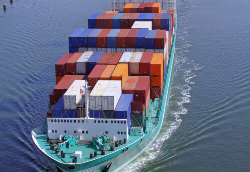 A container feeder ship on Kiel Kanal near the ship lock of Kiel-Holtenau, Germany