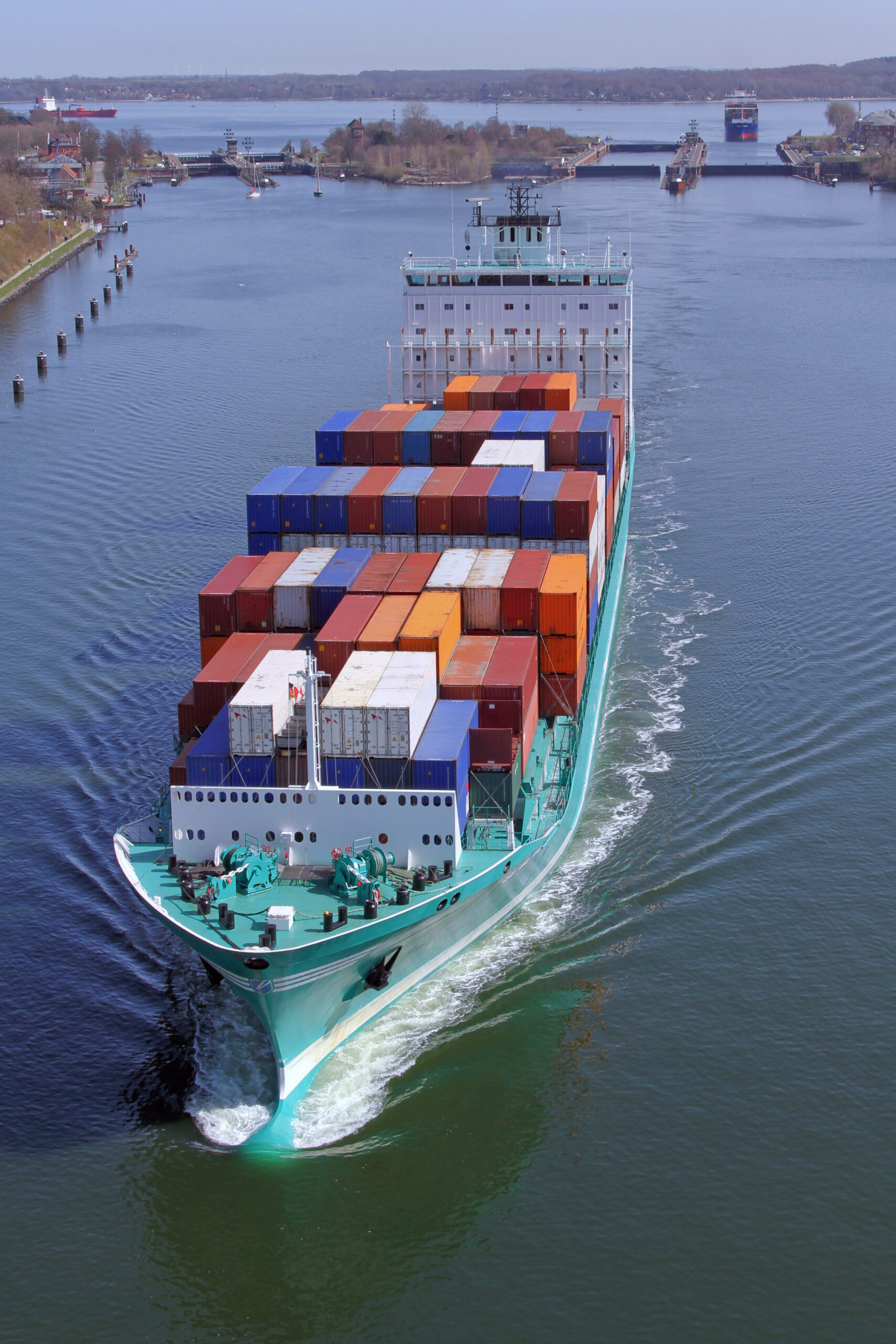 A container feeder ship on Kiel Kanal near the ship lock of Kiel-Holtenau, Germany