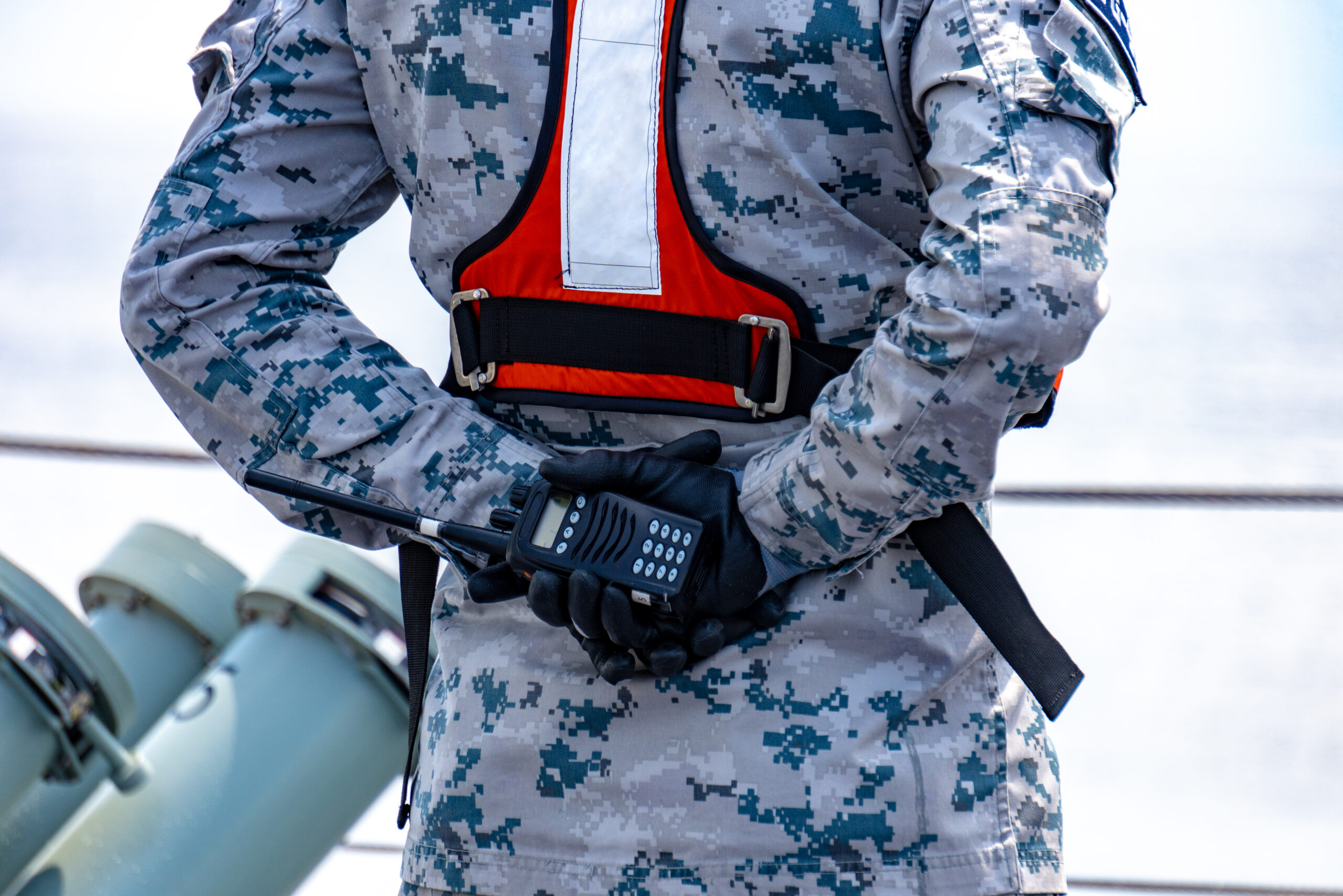 Sailor in grey and dark blue digital pattern camouflage uniform