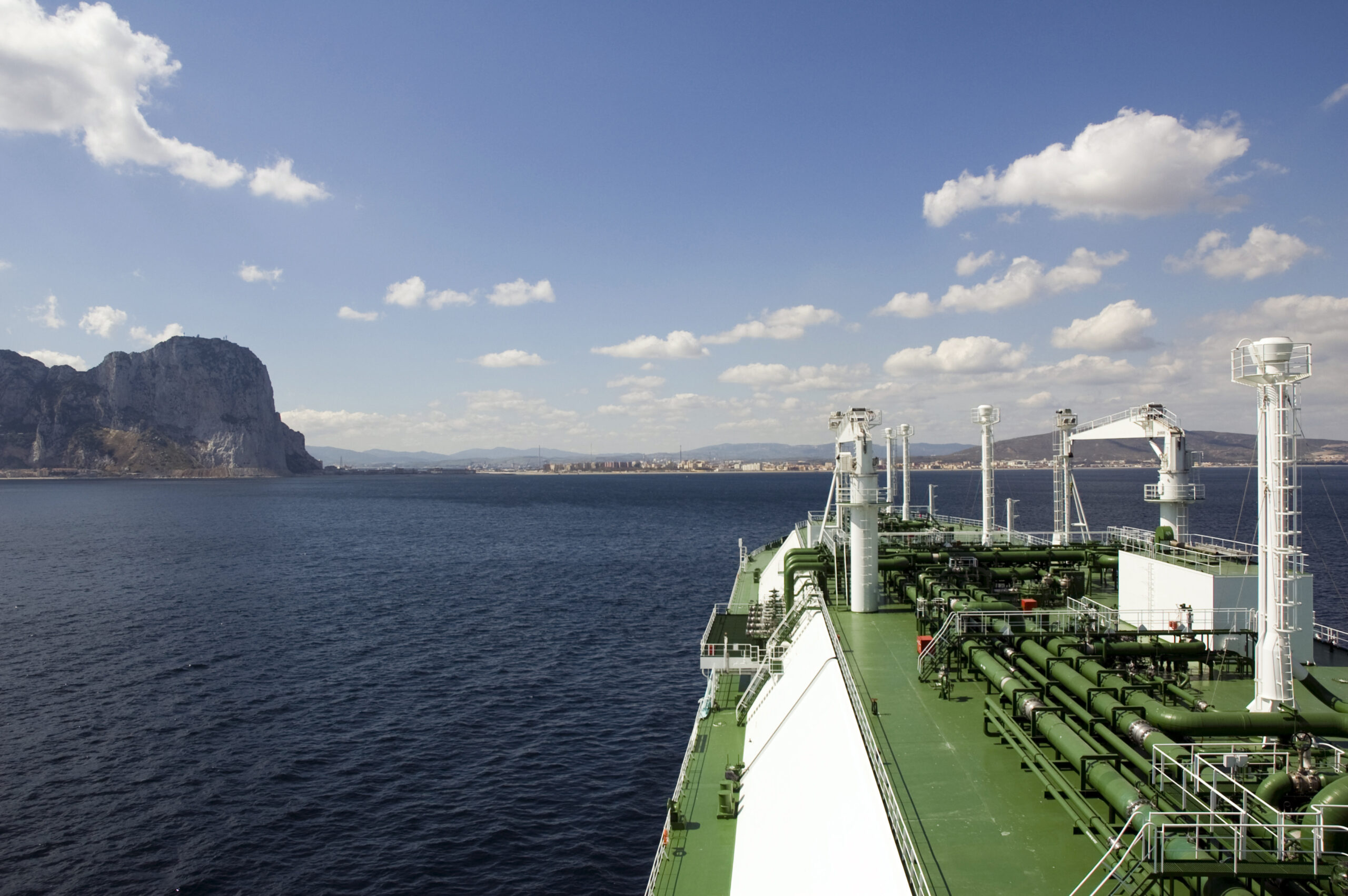 LNG carrier ship designed for transporting natural gas anchored off port.