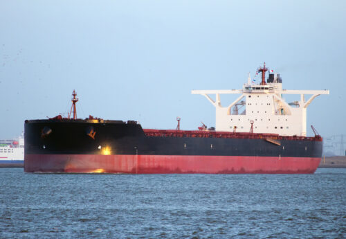 Capesize bulk carrier leaving port in ballast