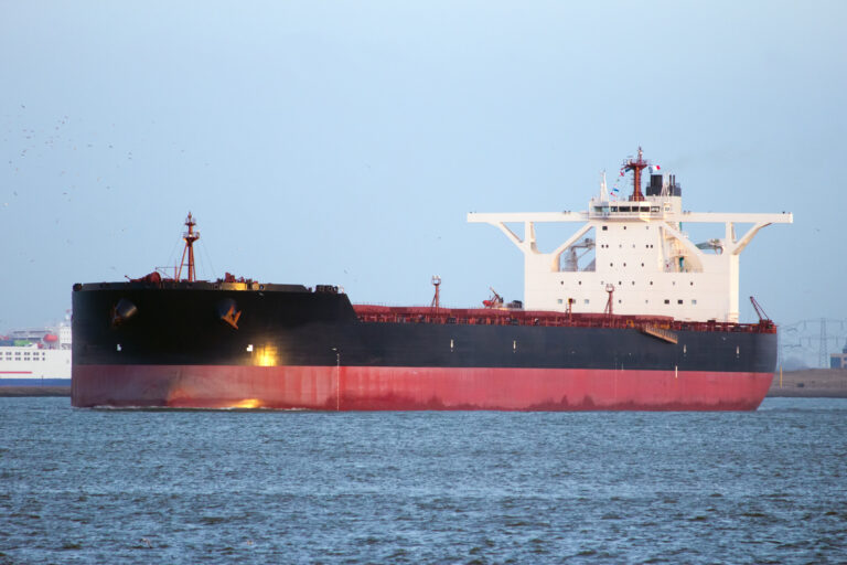 Capesize bulk carrier leaving port in ballast