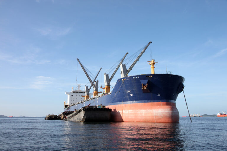 Supramax bulker with barges alongside