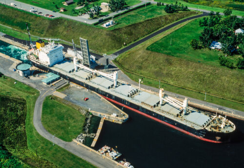 Aerial image of St. Lawrence Seaway,Ontario,Canada with a bulkcarrier passing.