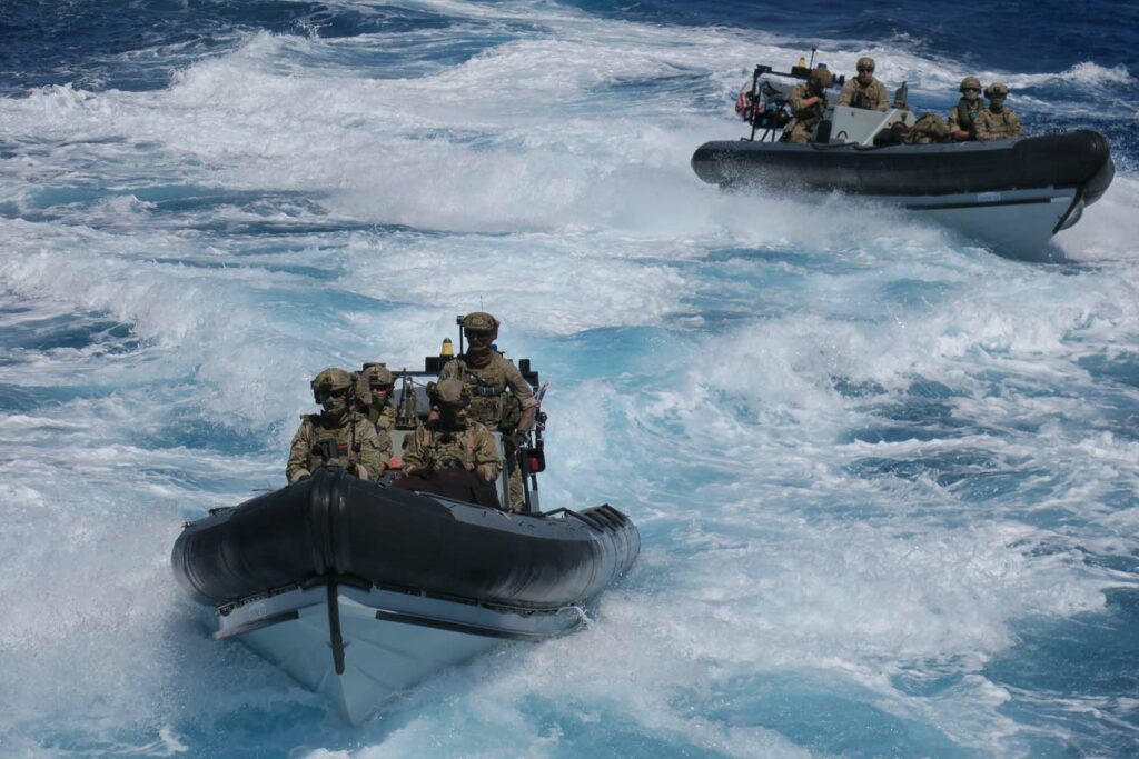 Dramatic pics show British warship seizing £17m of drugs in Caribbean Sea