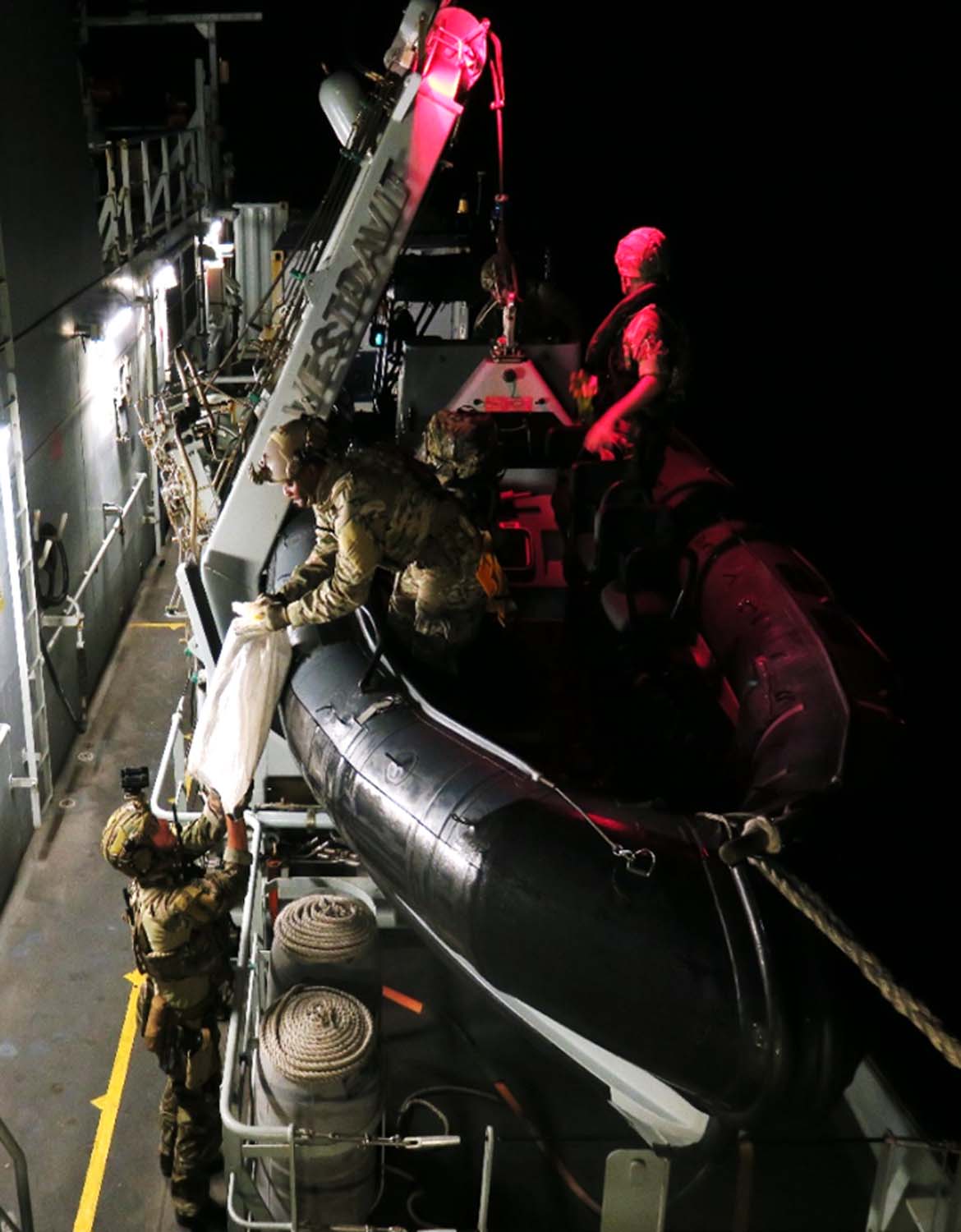 Dramatic pics show British warship seizing £17m of drugs in Caribbean Sea