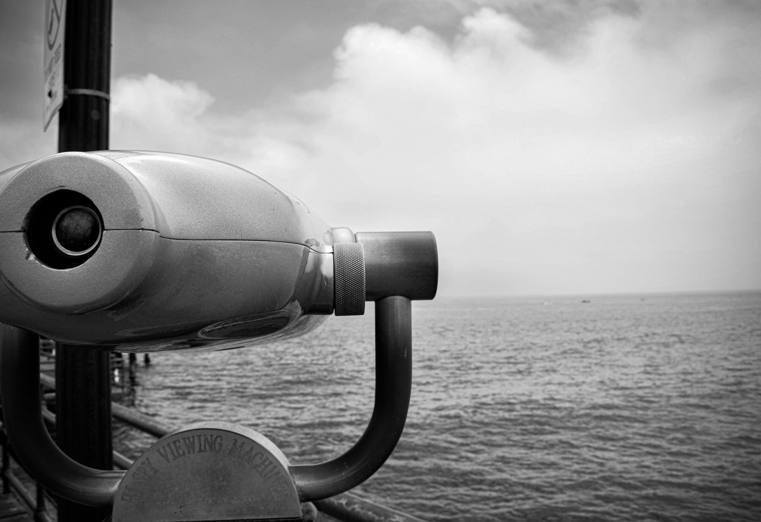 Binoculars on a ship looking to the seascape for other ships