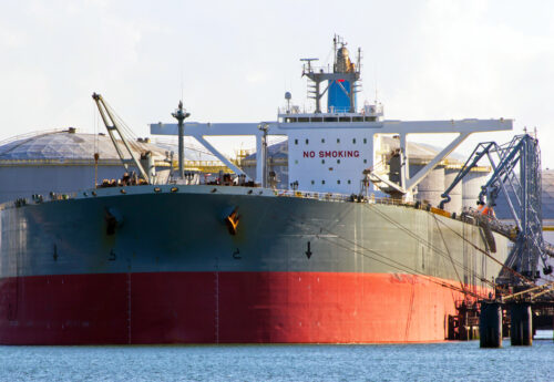 A very large crude oil tanker in the port of Rotterdam.