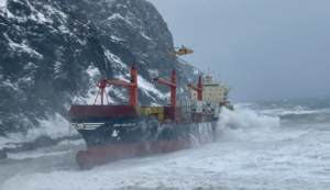 Crew rescued as cargo ship runs aground in rough seas