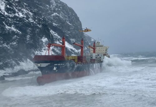 Crew rescued as cargo ship runs aground in rough seas