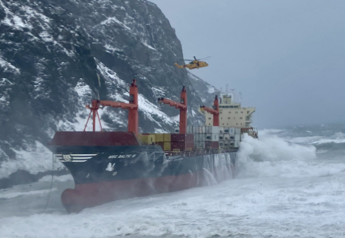 Crew rescued as cargo ship runs aground in rough seas