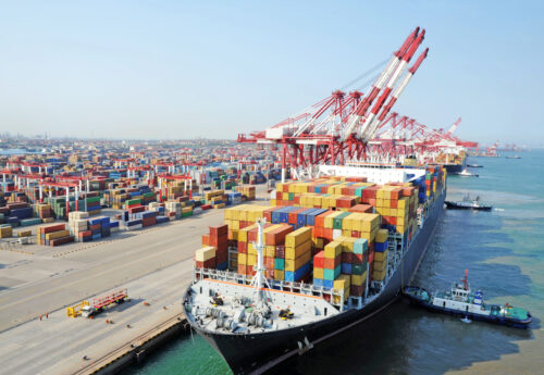 Container ship berthing at the container terminal in the port of Qingdao in China