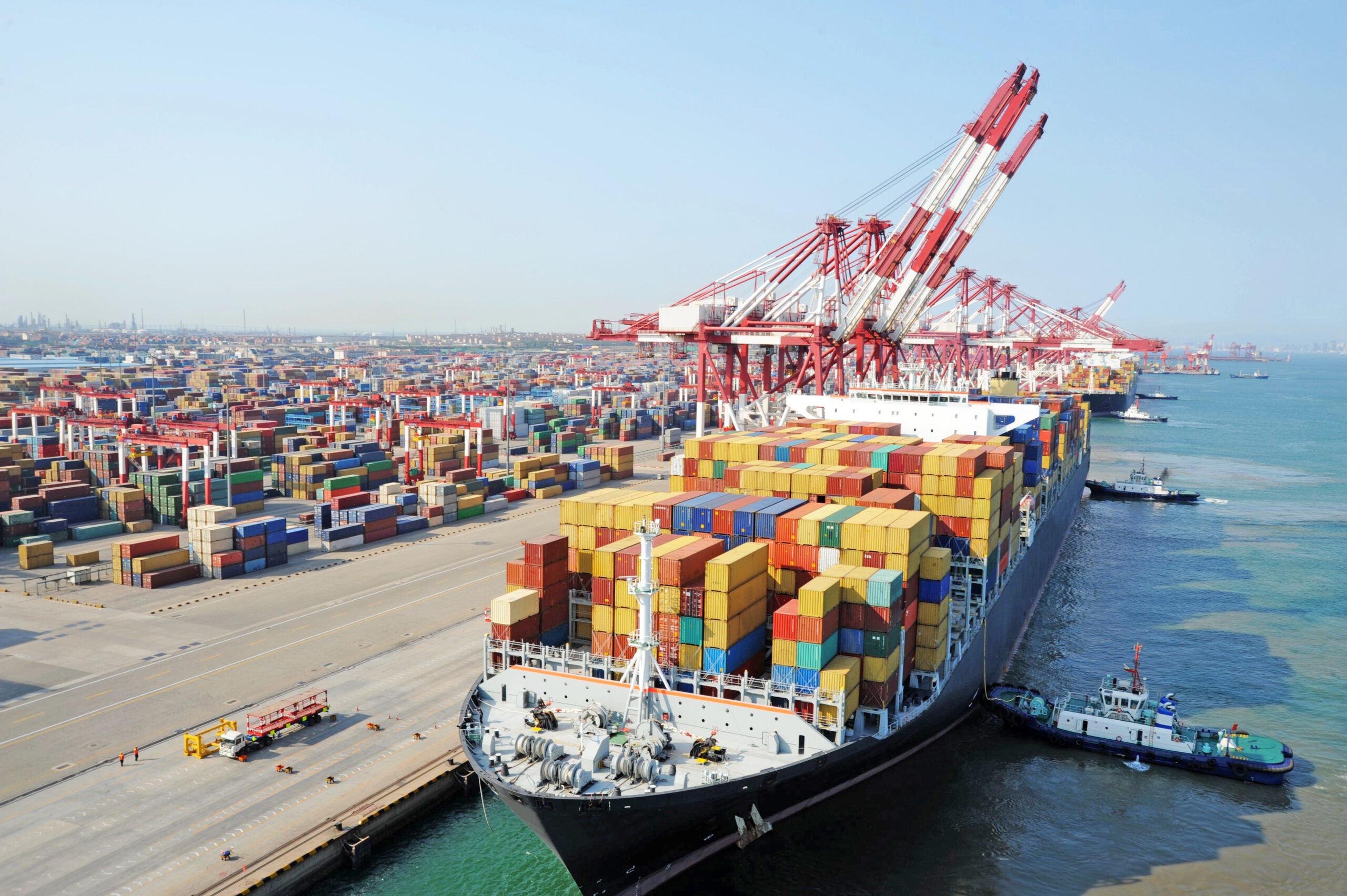 Container ship berthing at the container terminal in the port of Qingdao in China