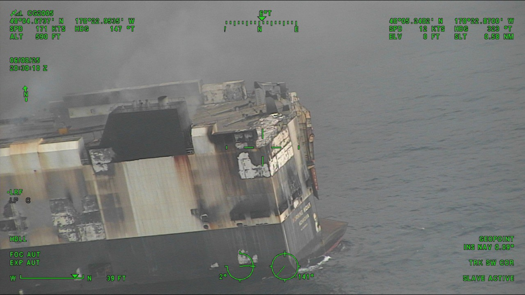 Dramatic images show the blaze-Zodiac vehicle carrier as salvage tug arrives