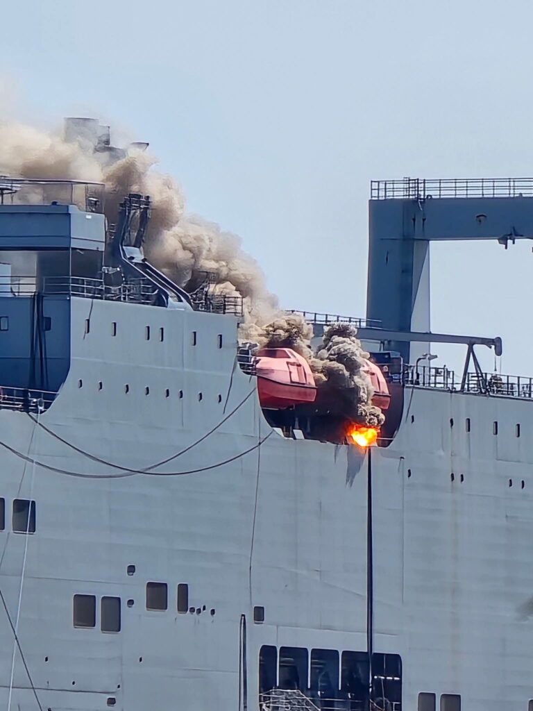 Crews investigate after two lifeboats catch fire aboard ship